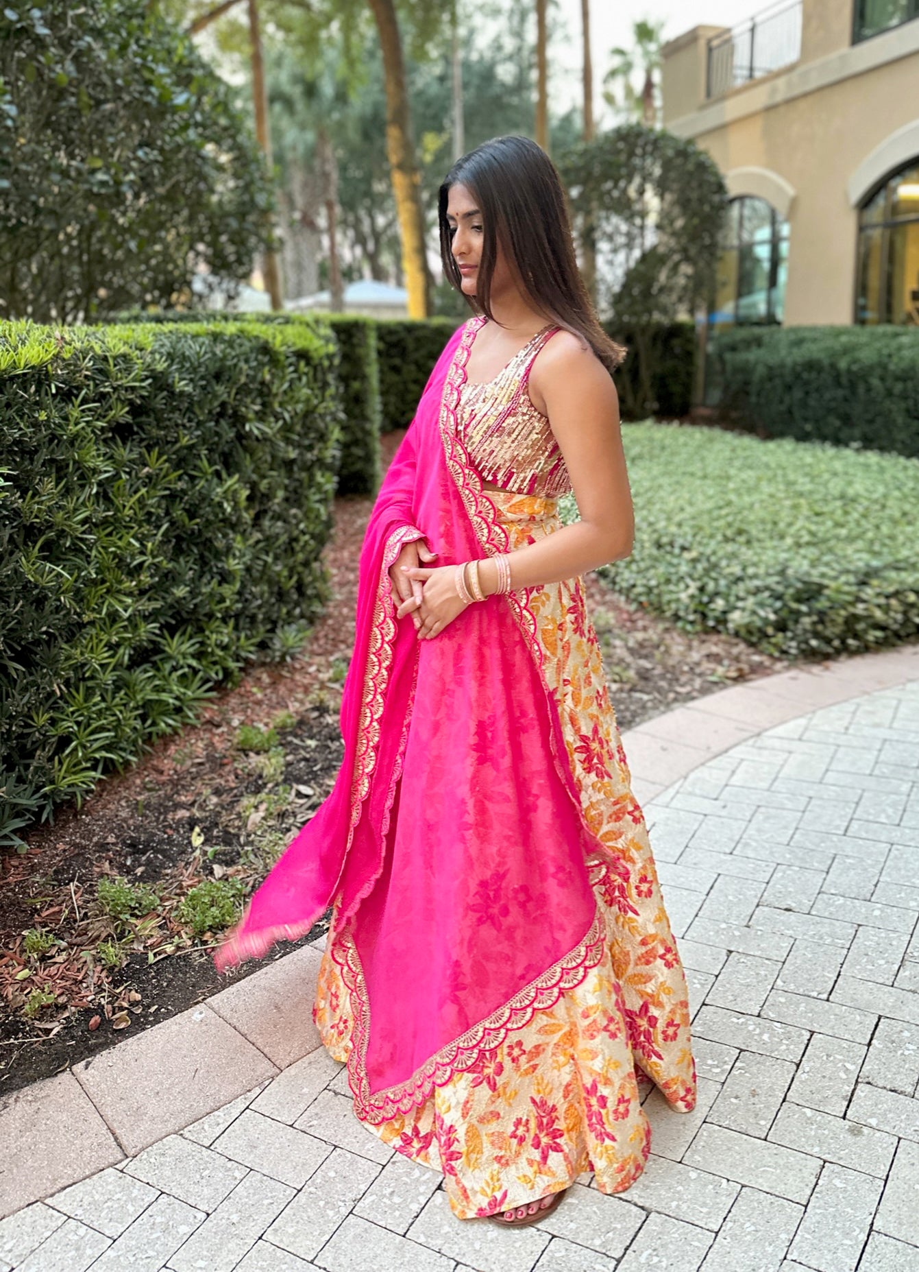 Photo of bright colorblocked lehenga in leheriya yellow pink and blue with  mirror work detailing